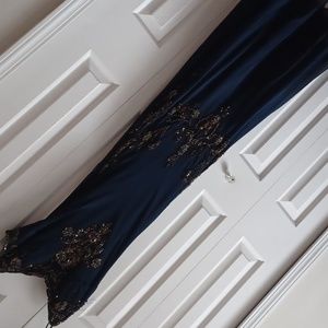 Midnight blue Xscape gown fit & flare style with bronze colored beads & sequins